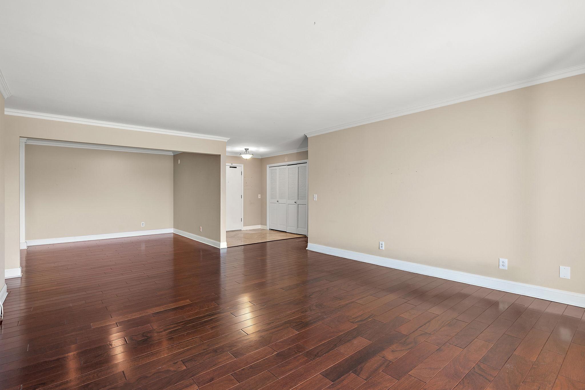 Living room looking toward dining and front entry