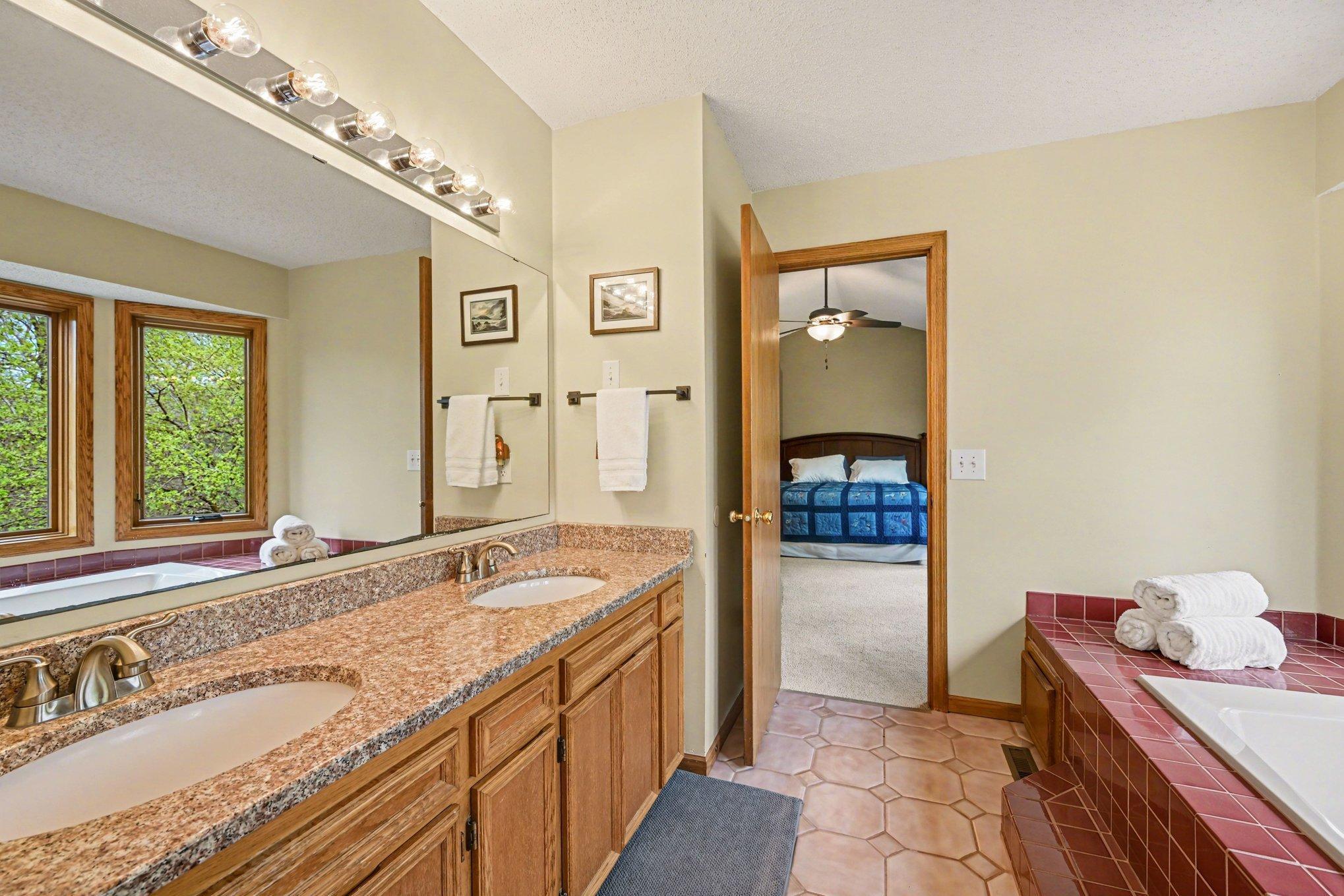 Owner's suite bath features dual sinks.
