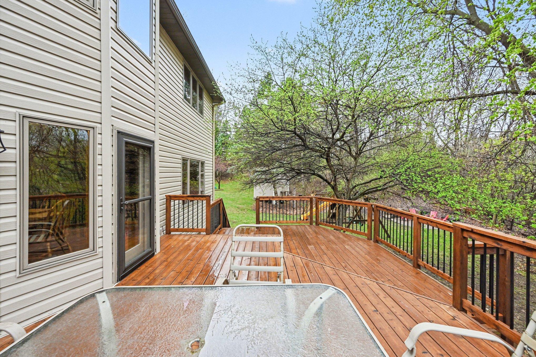 Deck stairs lead down to back yard providing easy access to green space.