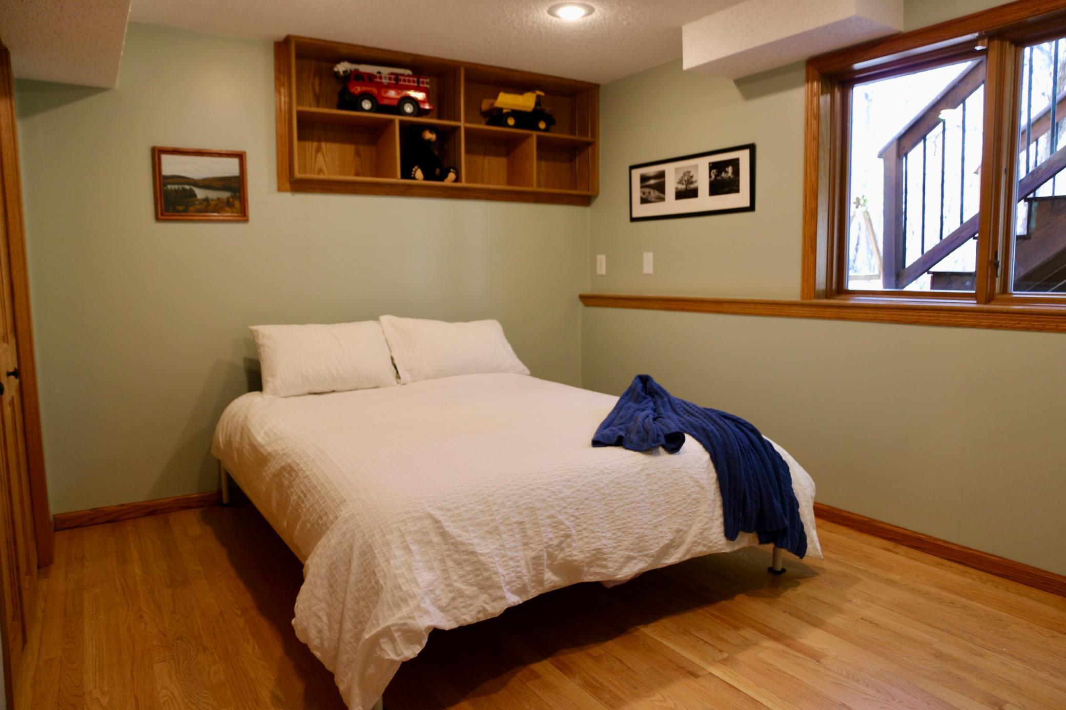 Lower level includes a fifth bedroom with lookout windows.