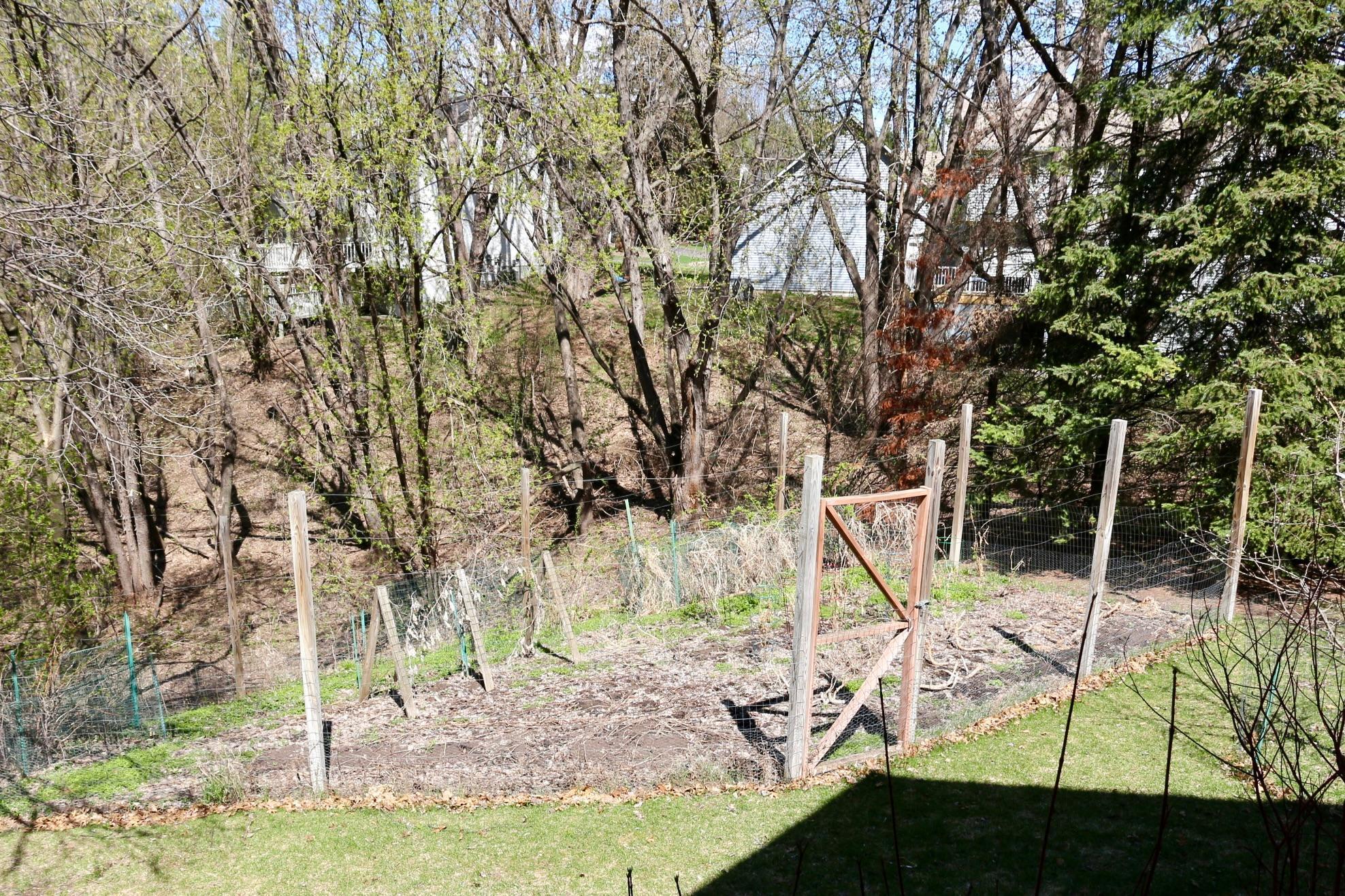 A fenced garden protects veggies from wildlife.