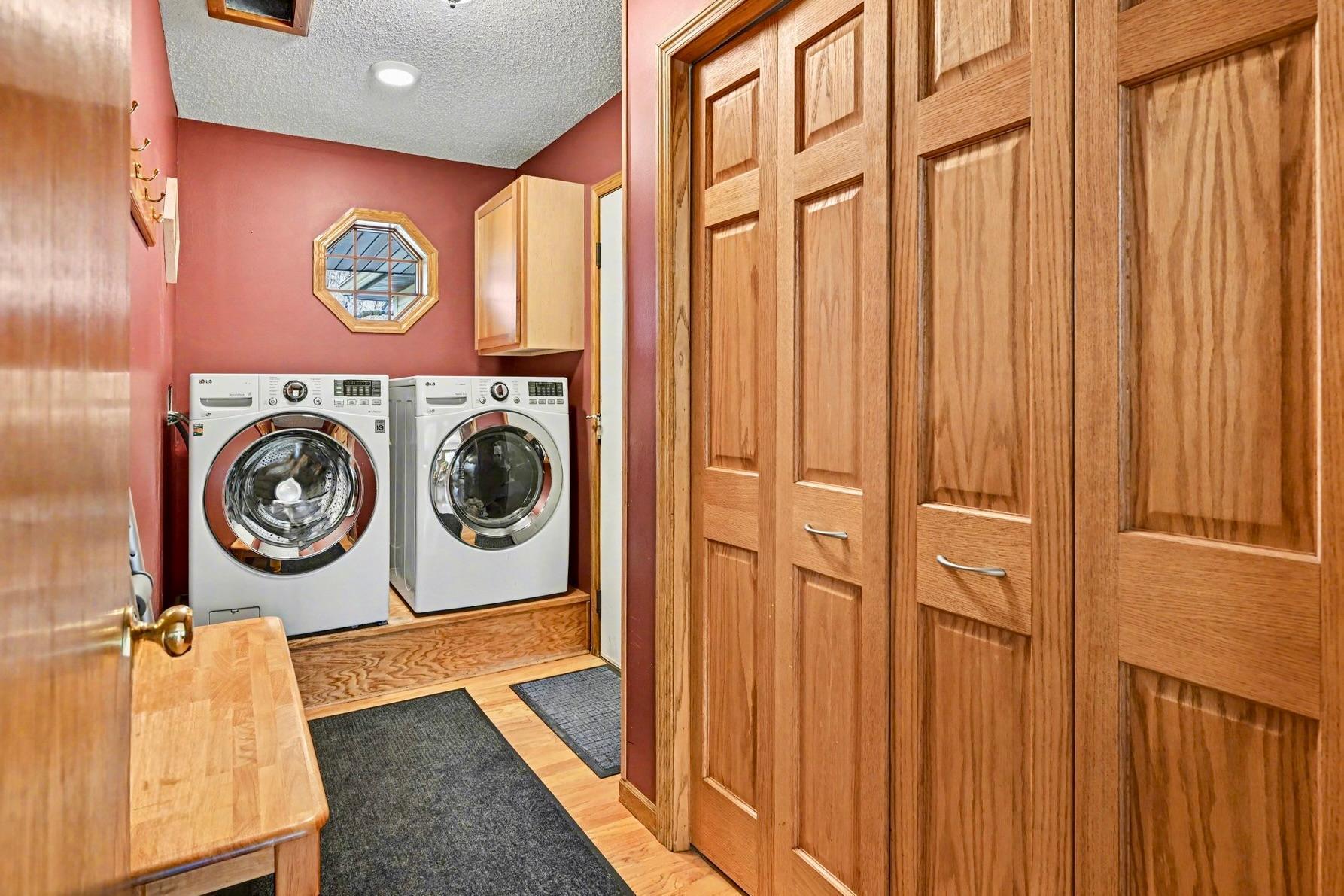 Main-level laundry with handy closet storage.