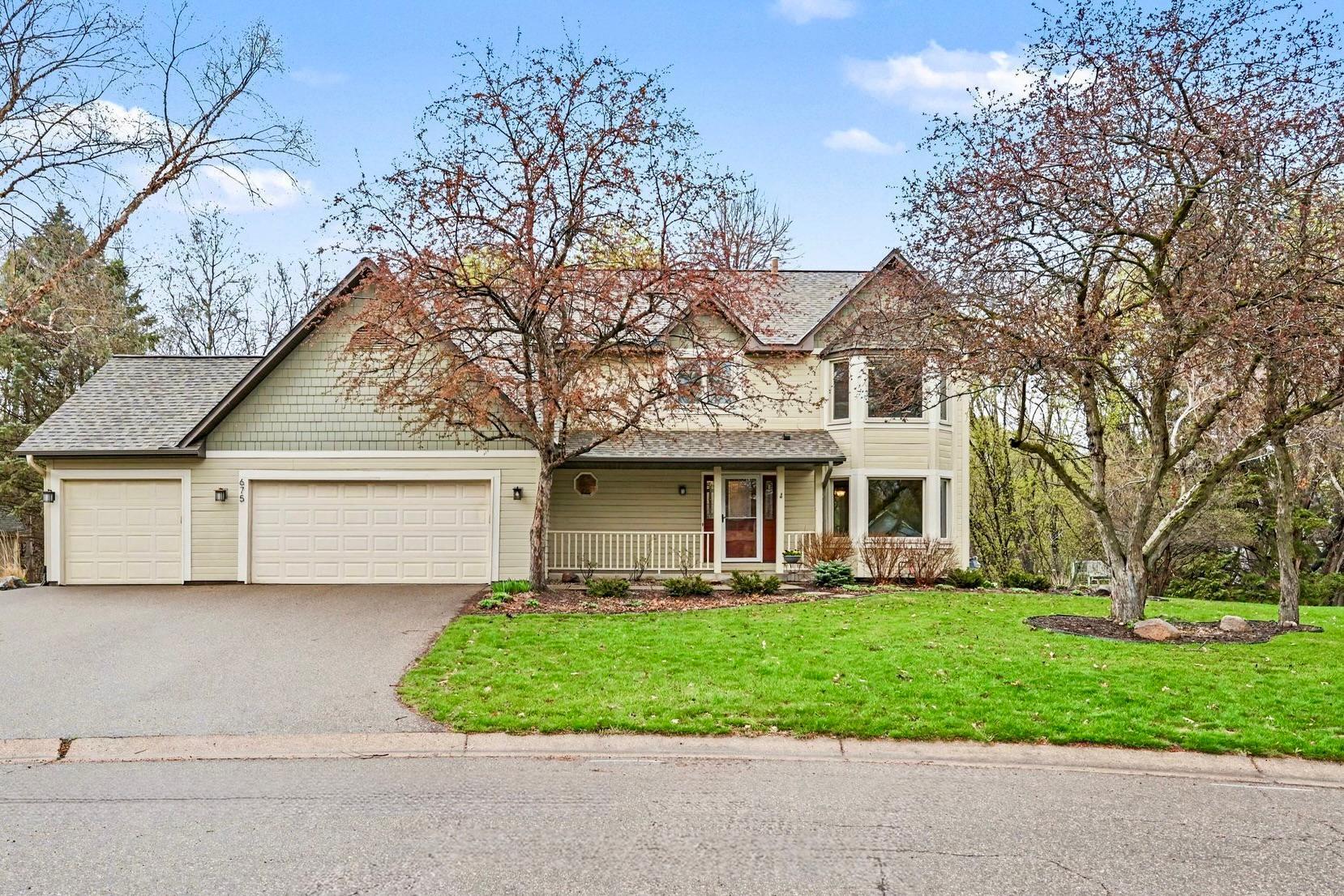 Home features a charming covered front porch overlooking a quiet cut-de-sac.