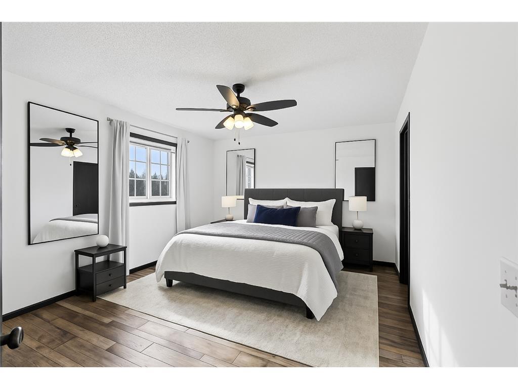 Large primary bedroom on upper level, walk in closet and walk-through bathroom.