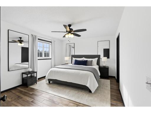 Large primary bedroom on upper level, walk in closet and walk-through bathroom.