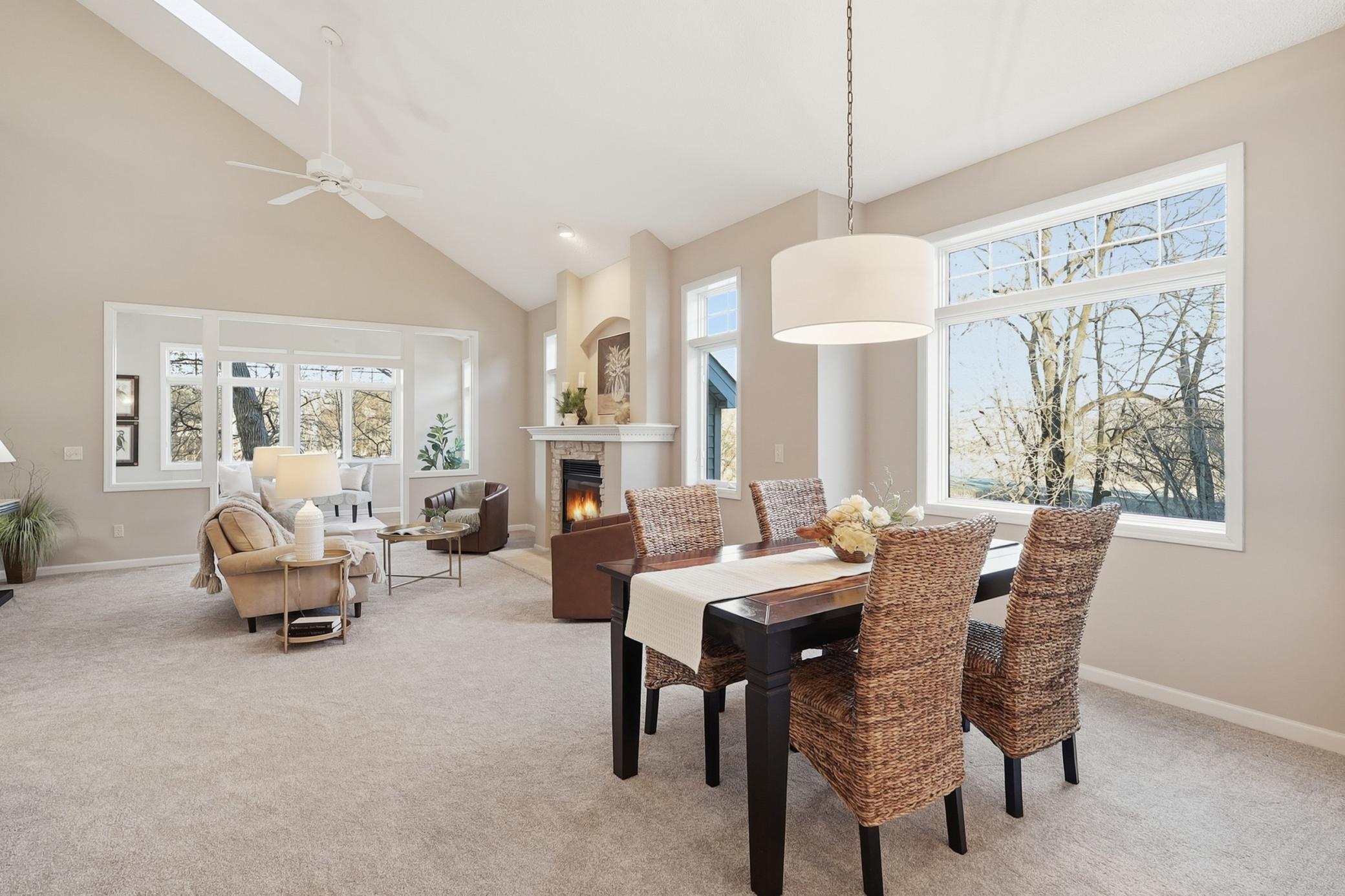 Dining area has new chandelier and plenty of space for hosting.