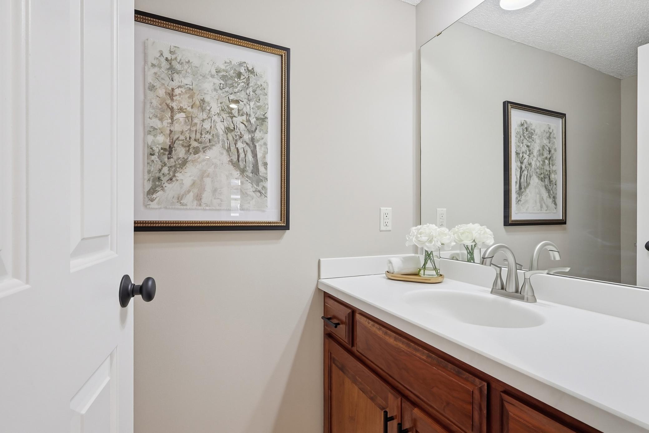 Large half bath off the kitchen and laundry area.