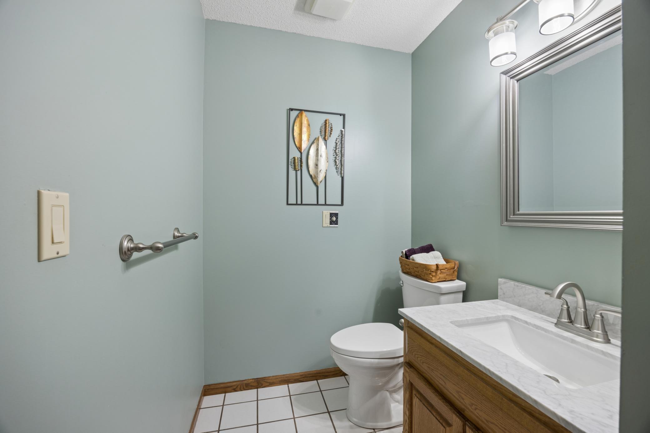 Main floor half bath with new sink and counter top.