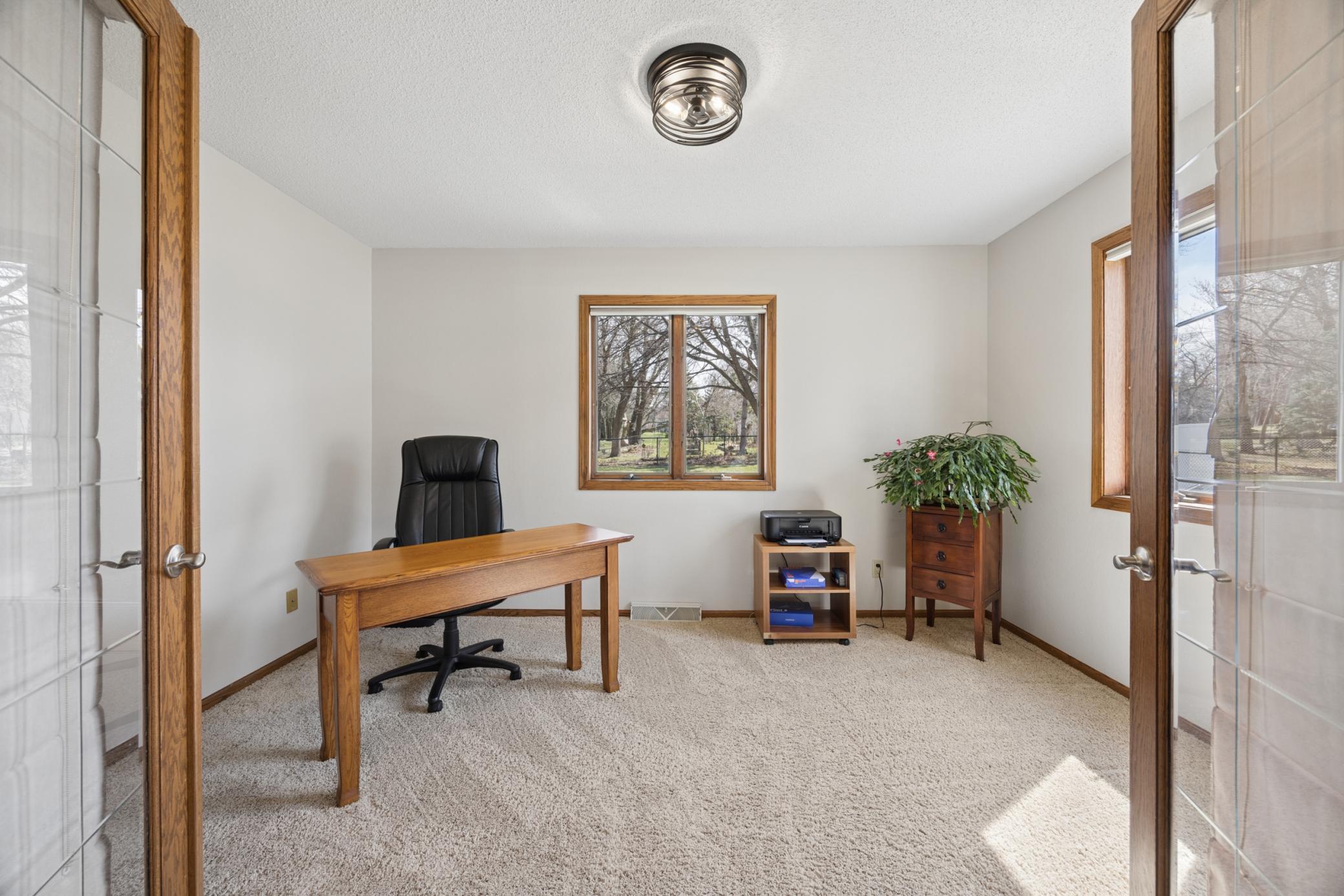 Sun room/office with glass French Doors.