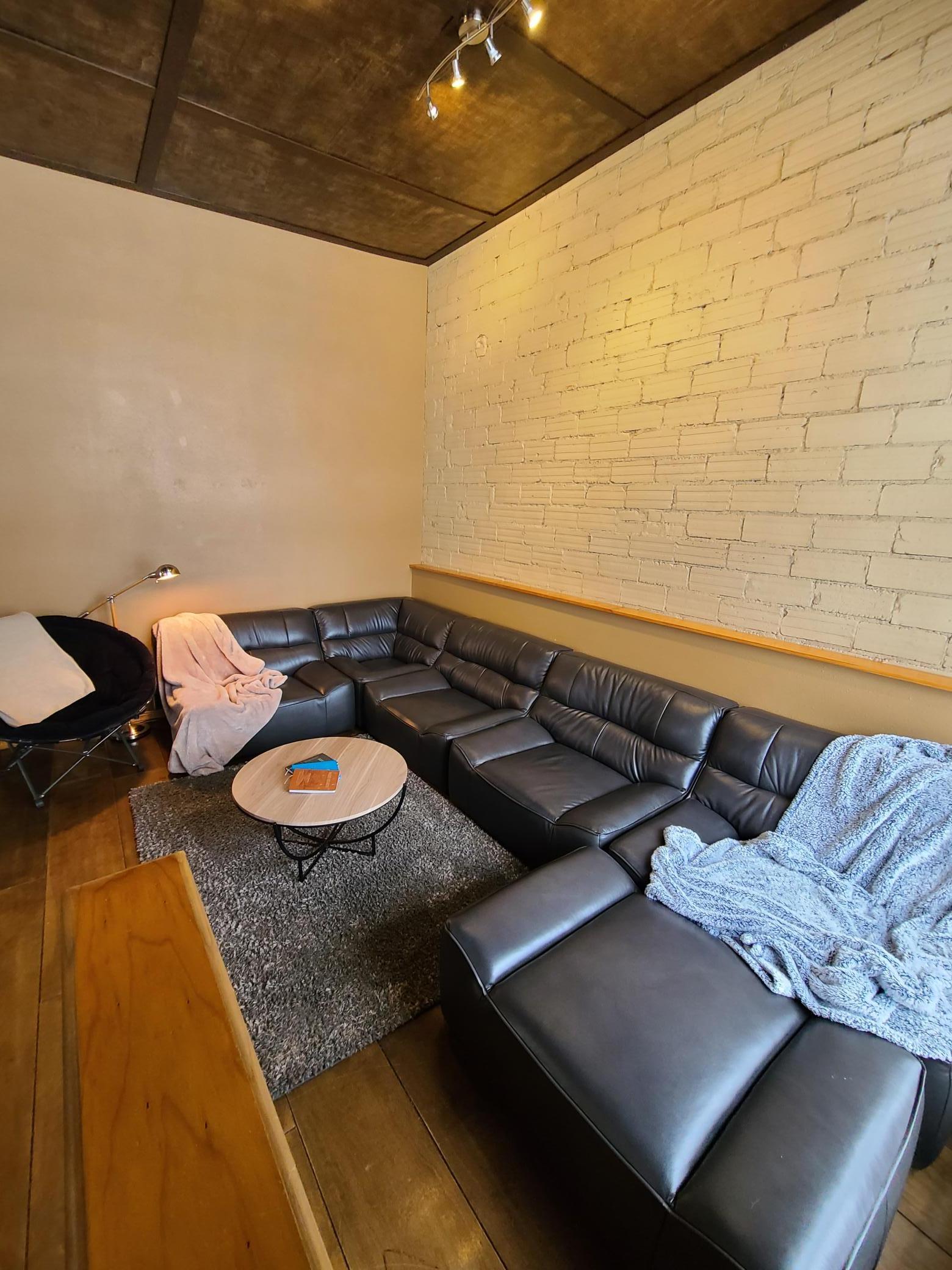 Living Room view 2, exposed brick wall