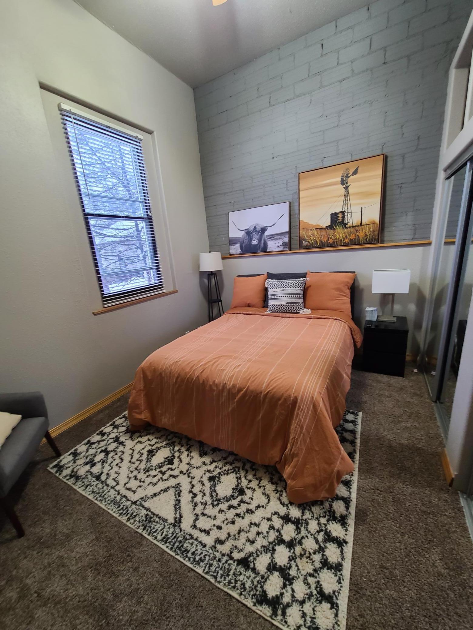 Bedroom 2 view 1, exposed brick wall