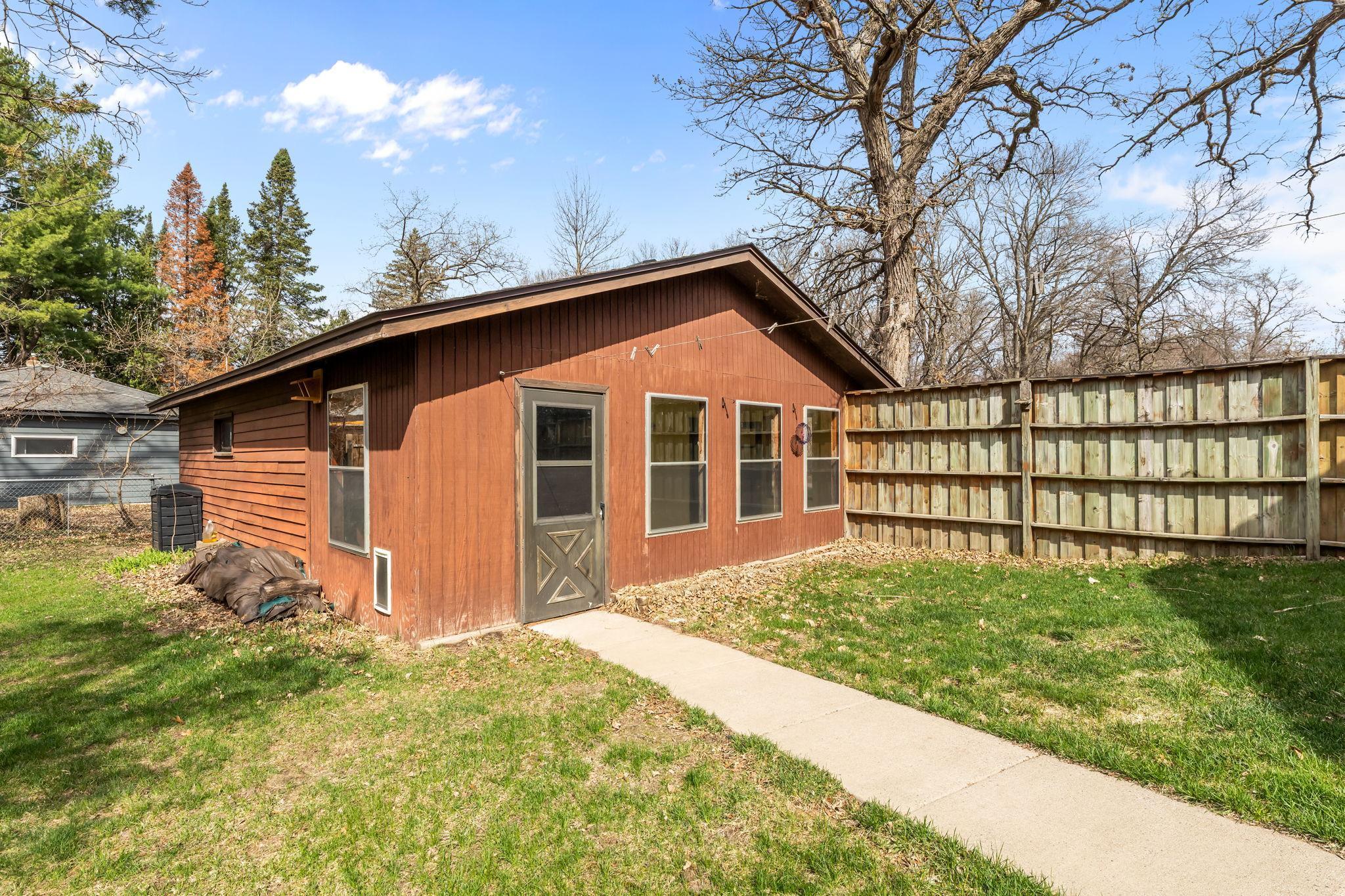 View of the garage and three season porch.