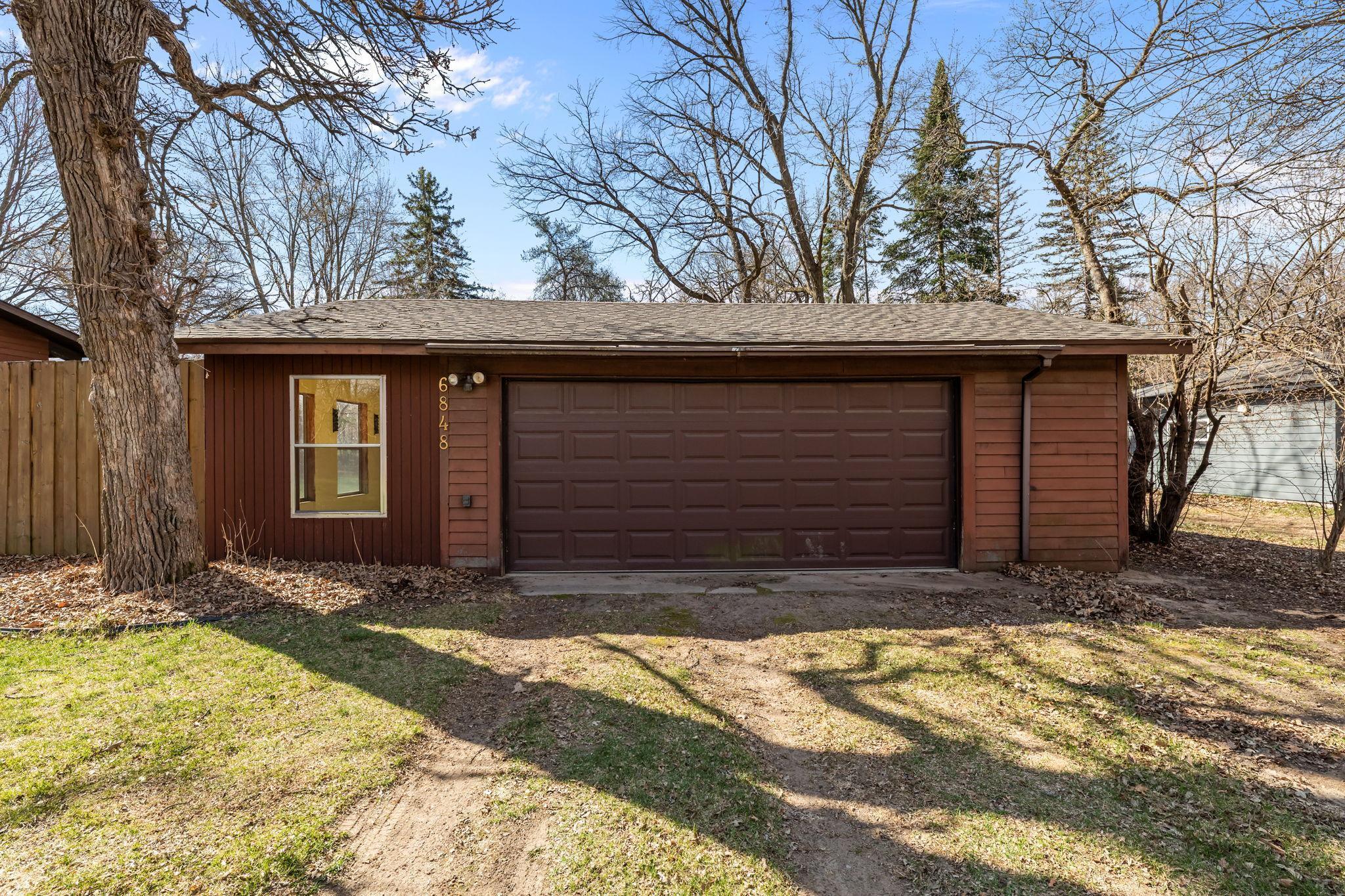 Oversized two car garage with adorable three season porch.
