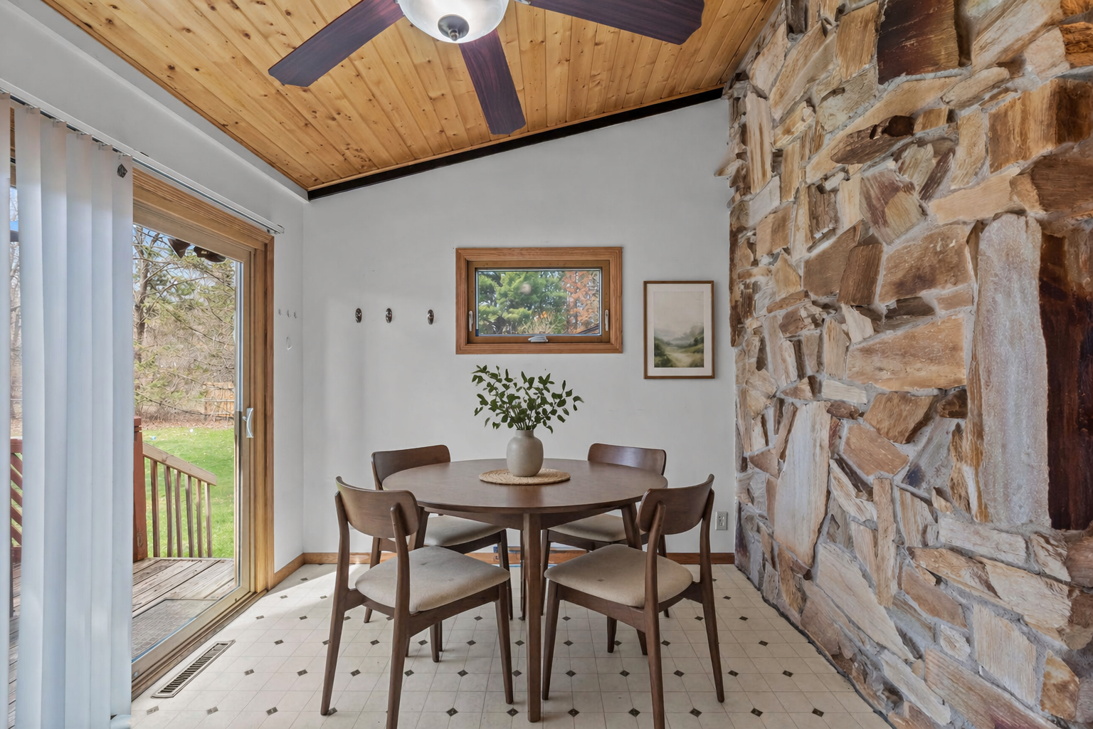 Eat in kitchen is so stylish with the exposed masonry wall.