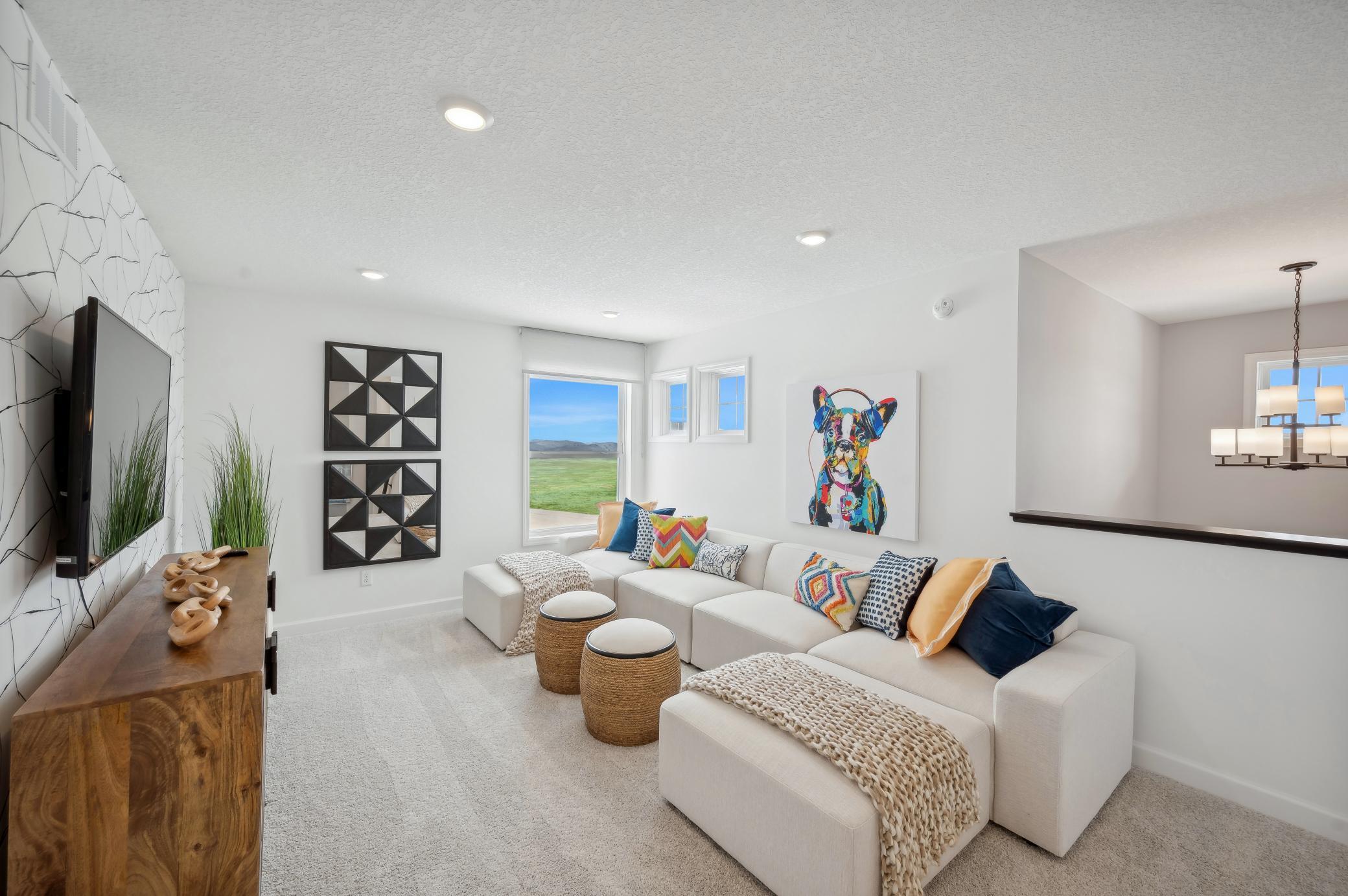 (Photo of a decorated model, actual homes finishes will vary) Upper level loft.