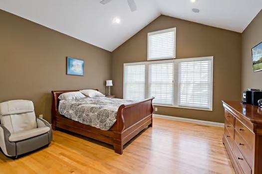 Vaulted Primary Bedroom with a wall of windows!