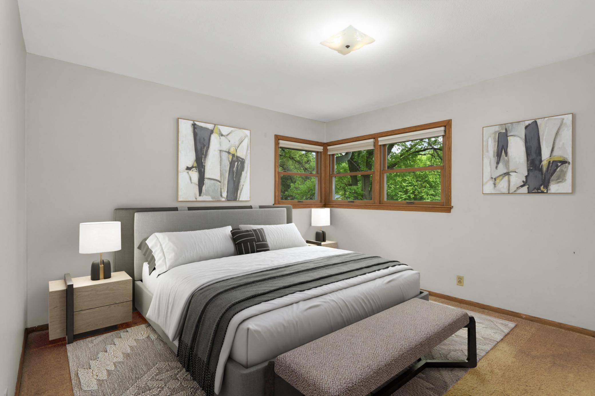 The primary bedroom overlooks the backyard.