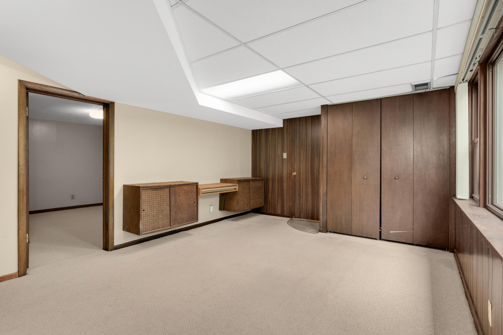 This space would make a great mudroom/home office, and then a TV room could get added in the unfinished space.