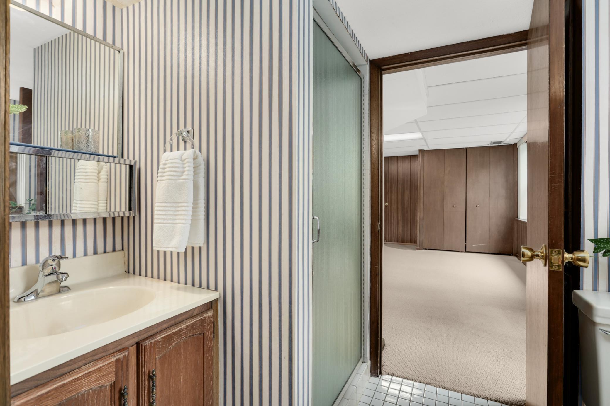 The lower level three-quarter bath is so convenient.