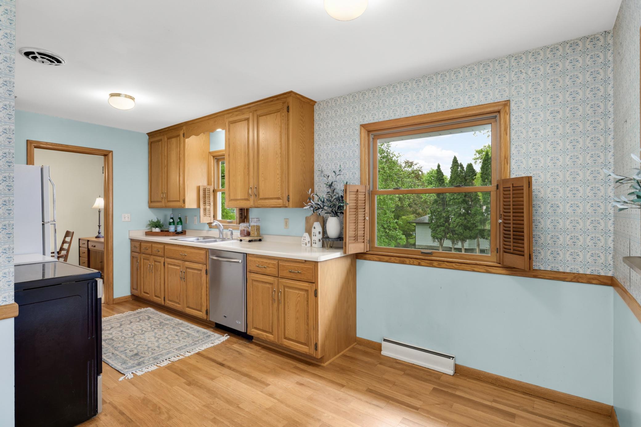 Enjoy solid wood cabinetry and windows that overlook the backyard.