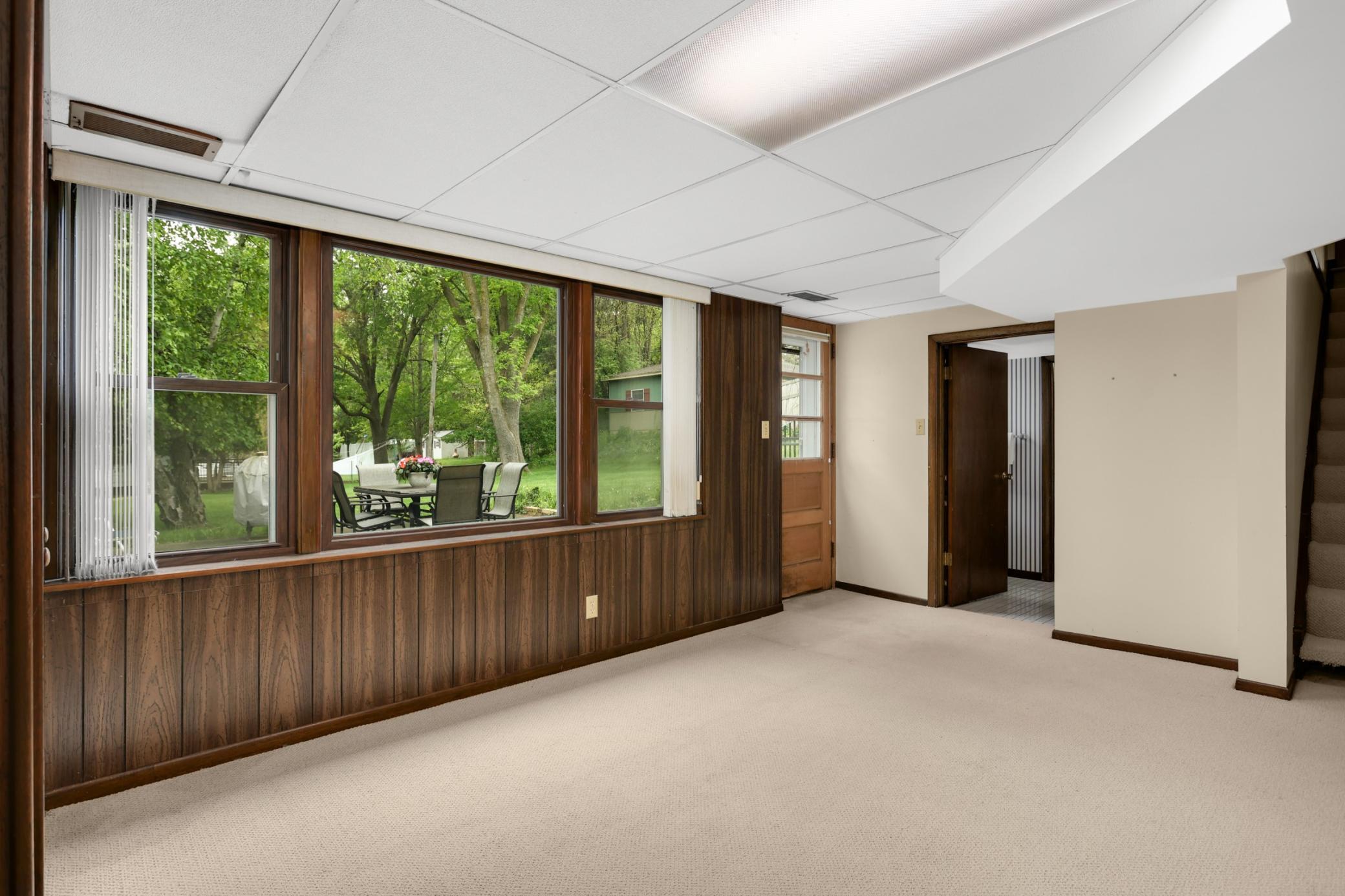 The lower level walks out to a secondary patio and also features another family room with the second wood-burning fireplace.