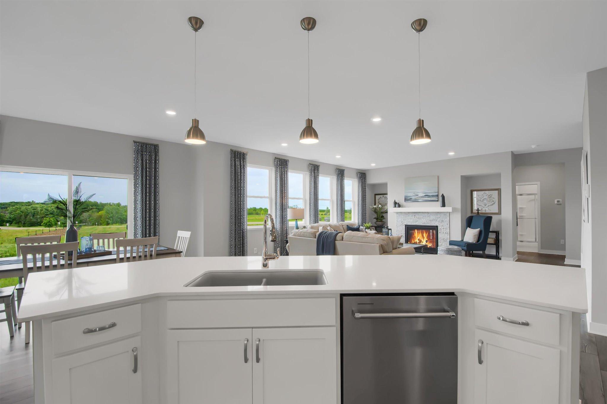 Large center island with lots of seating to eat or entertain.