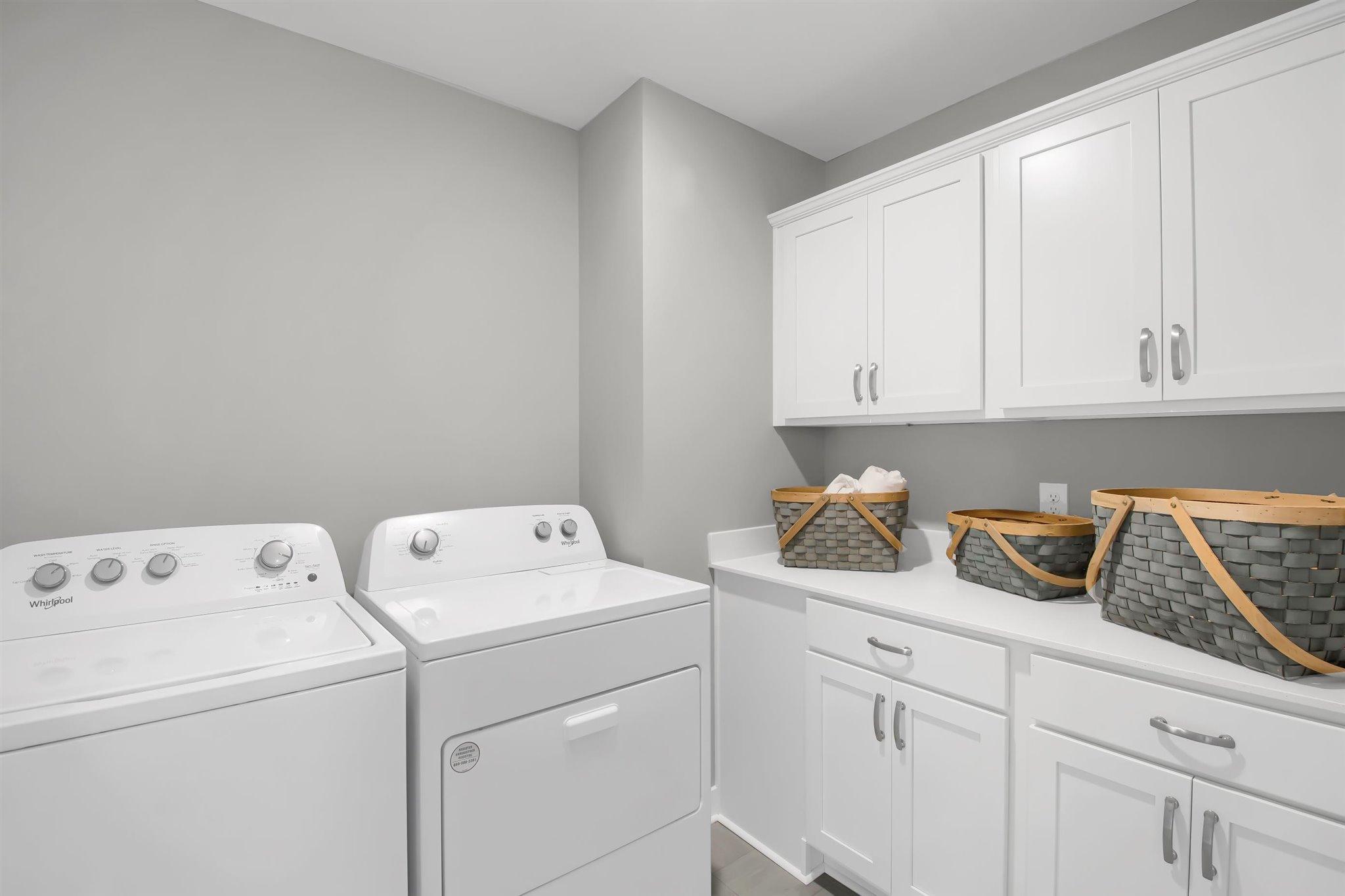Upstairs laundry with cabinets (colors and options vary)