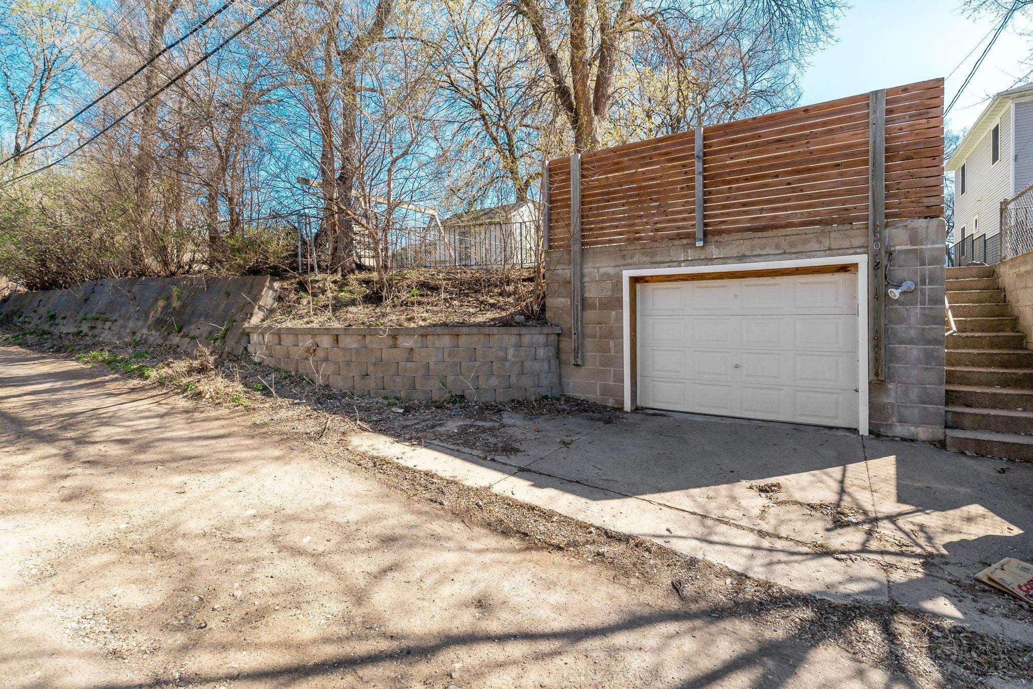 Garage with new landscaping and sealing