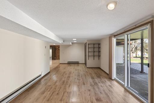 Lower level walkout and cedar closet behind the shelving