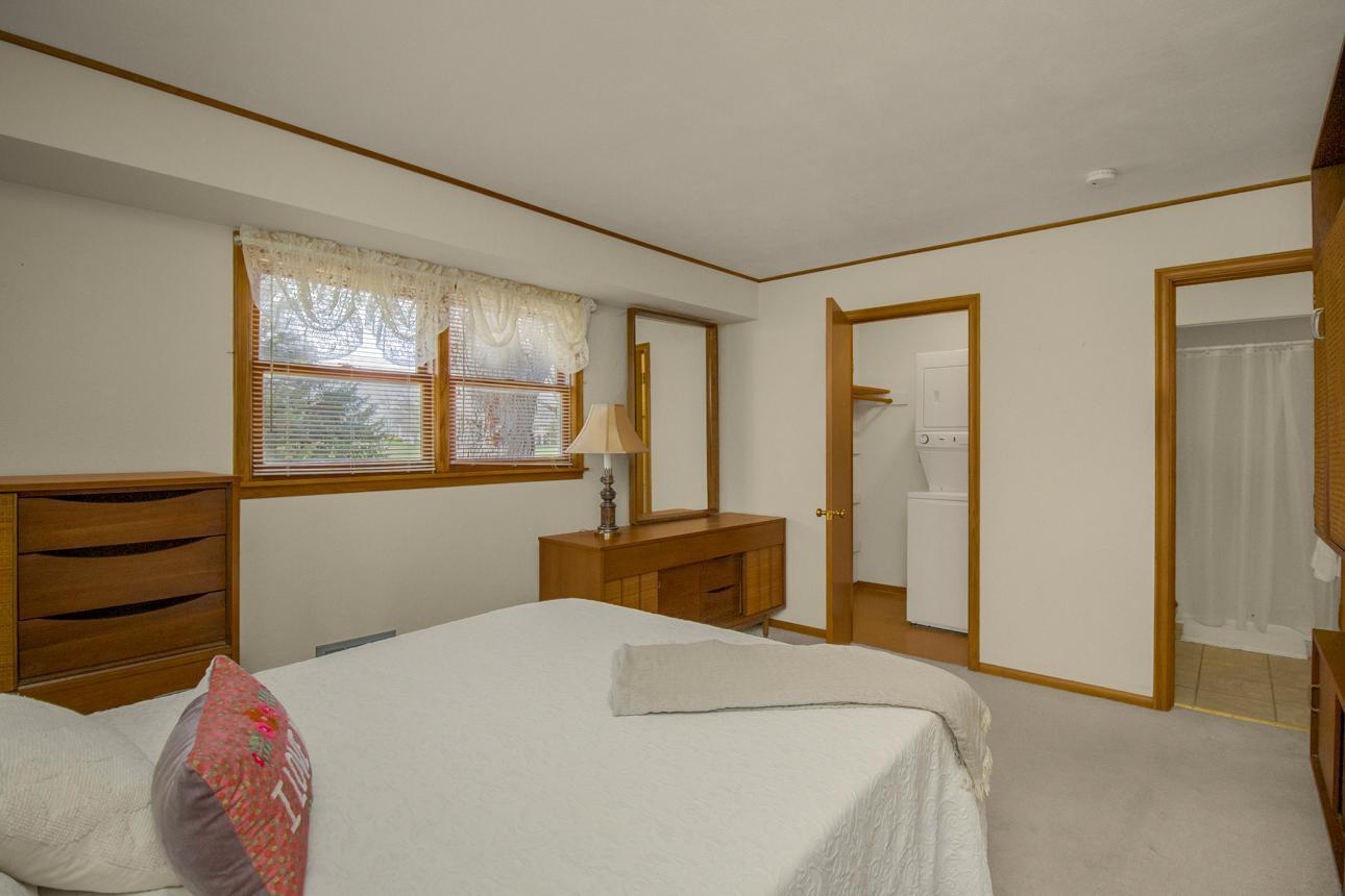 Laundry in primary bedroom.