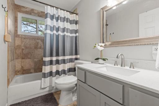 Nicely Renovated, the Upper Level Bath has Re-tiled Shower with New Shower Head, upgraded marble vanity, and new toilet in 2026