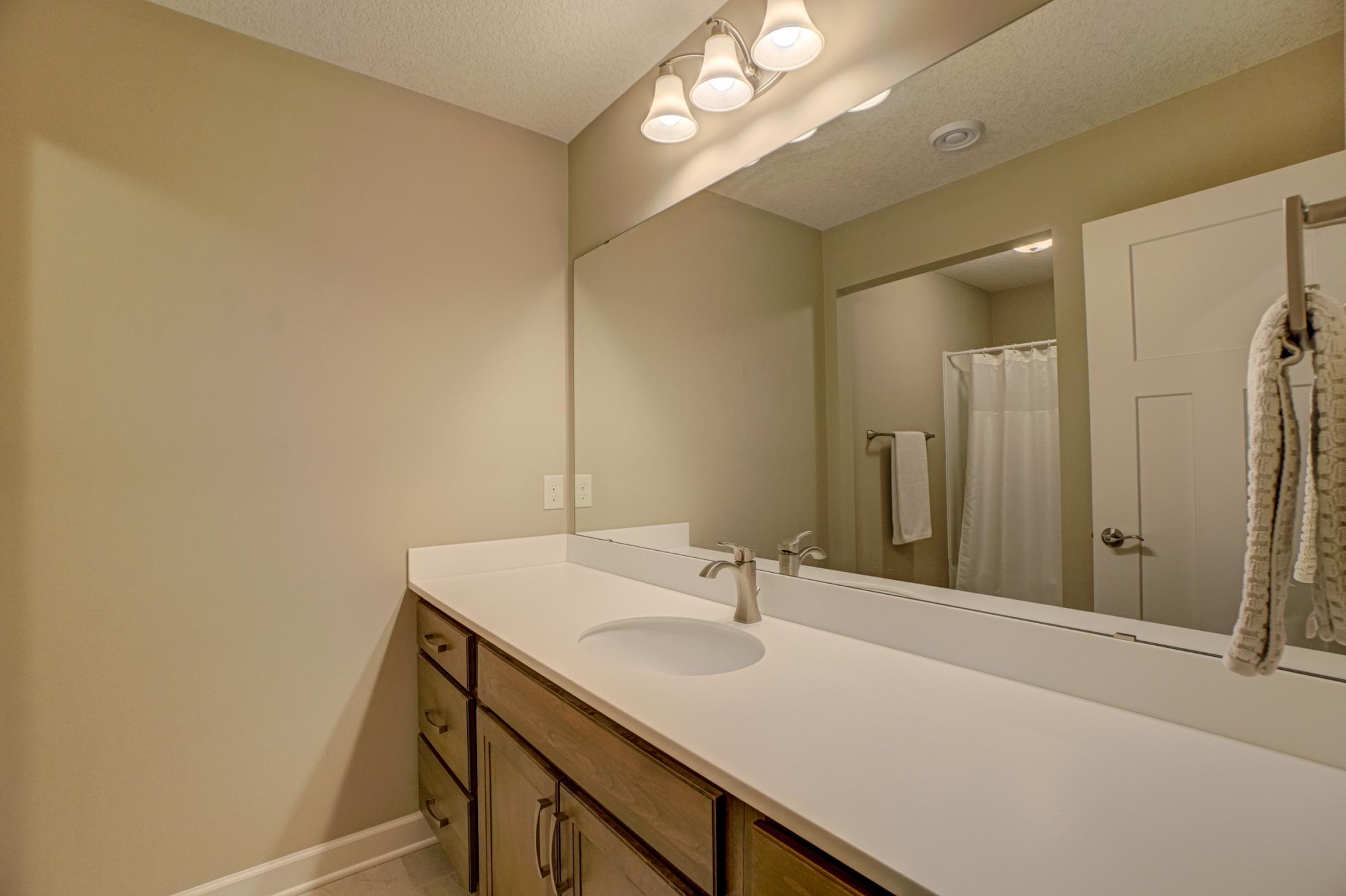 The lower-level full bath adds flexibility and convenience—perfect for guests or everyday use