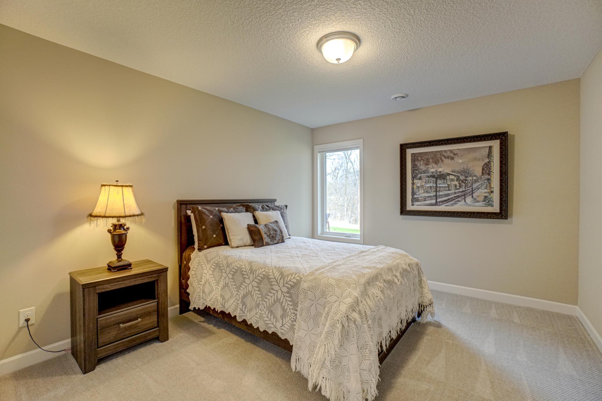 Private lower level bedroom—great for overnight guests or multigenerational living