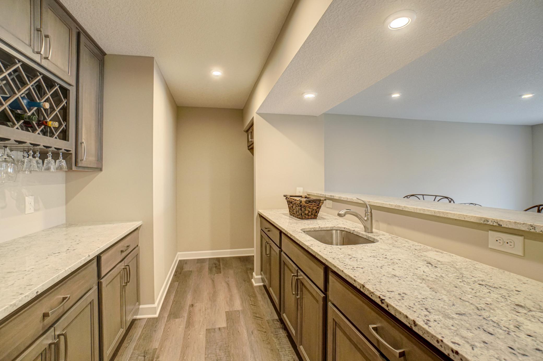 Entertaining is breeze with this stylish wet bar and ample space for gatherings