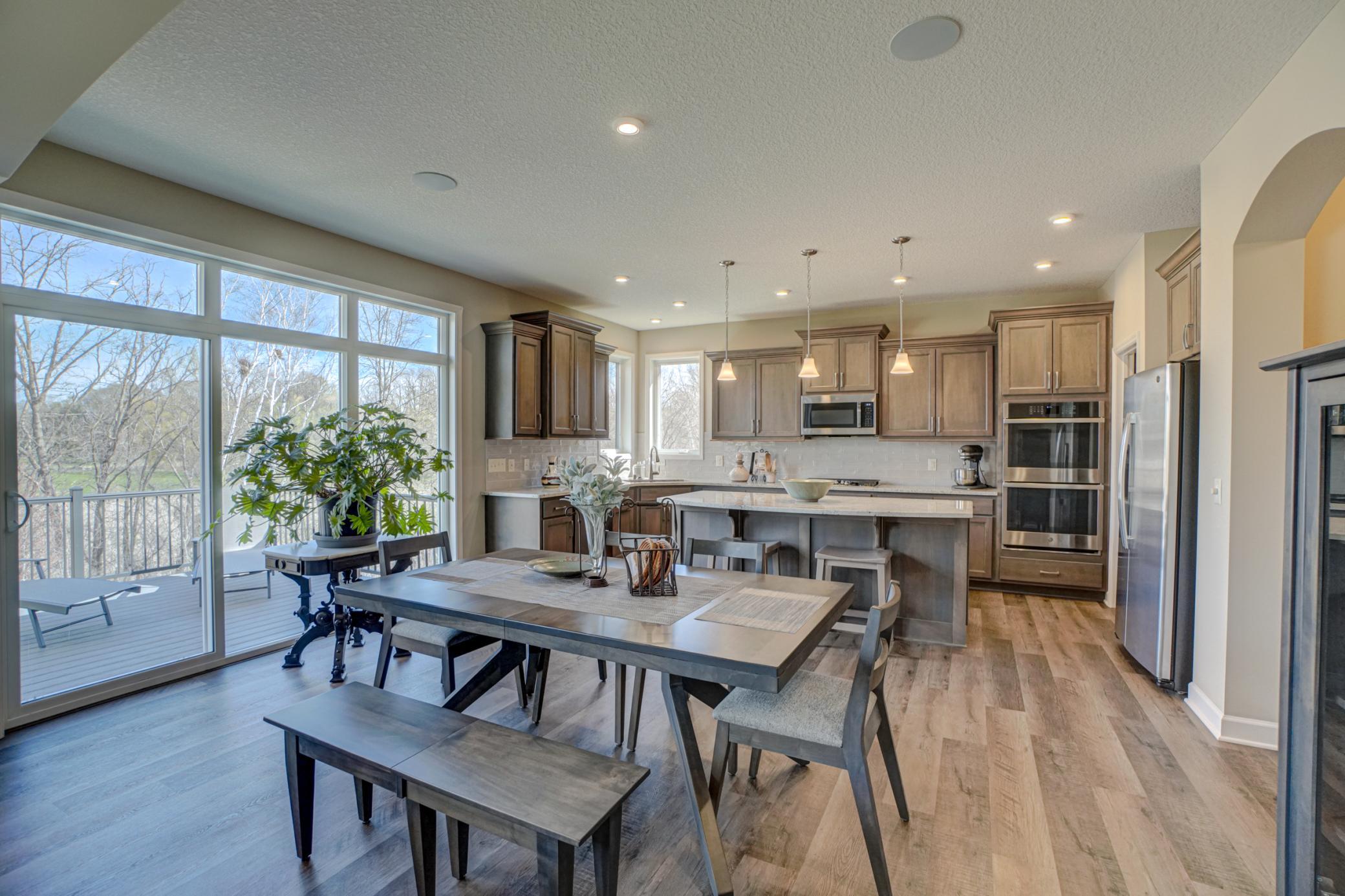 This dining area with picturesque views sets the stage for unforgettable dinners and special gatherings