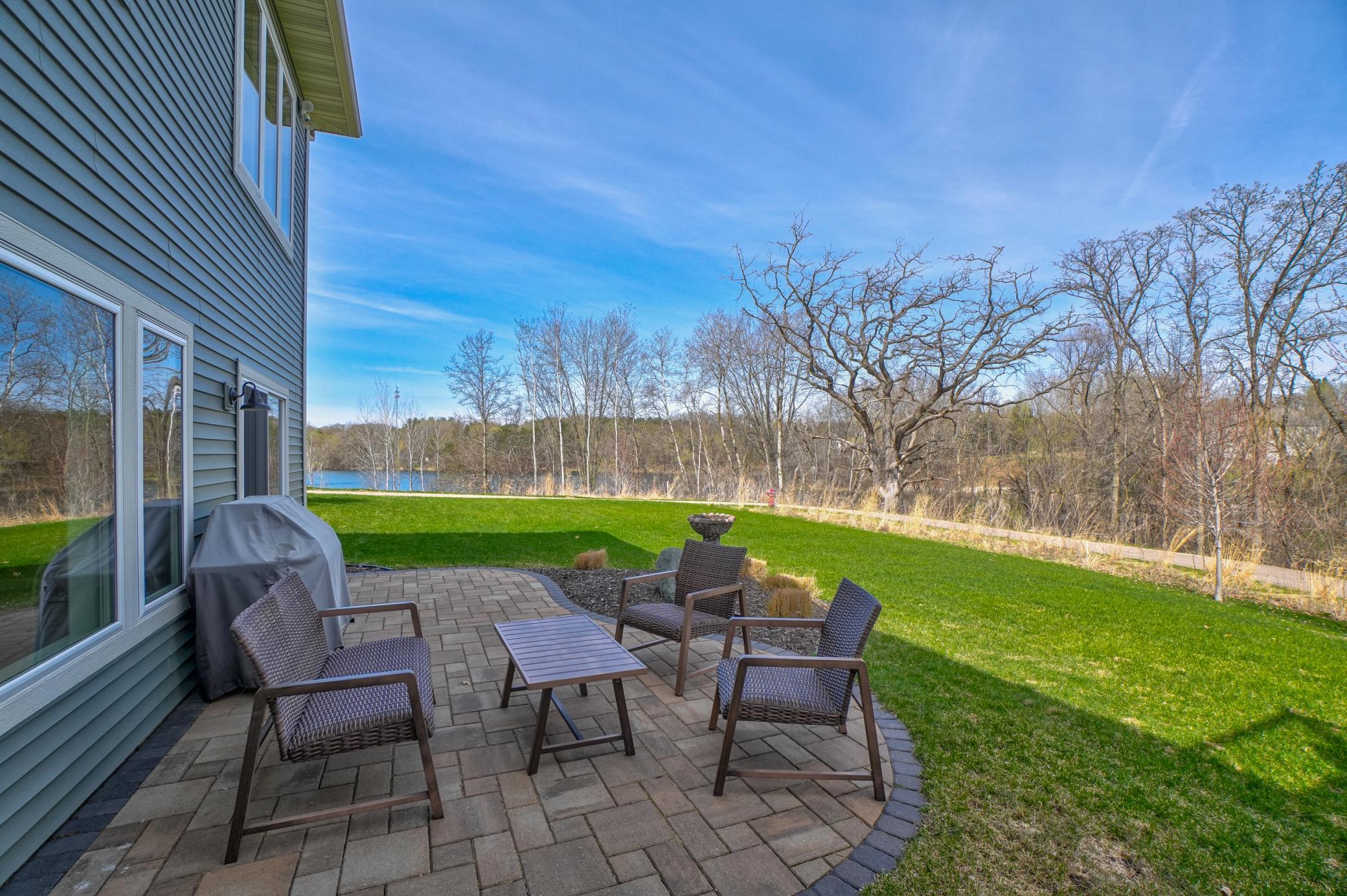 Step outside to the paver patio and take in the peaceful, tree-lined views—perfect for enjoying quiet mornings or evening get-togethers