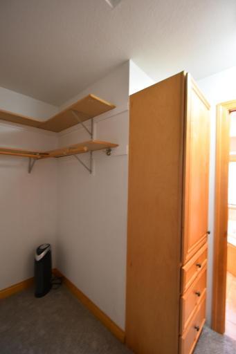 Primary bedroom walk in closet