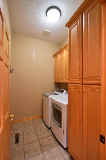 Main floor laundry-newer washer & dryer & abundance of cabinets