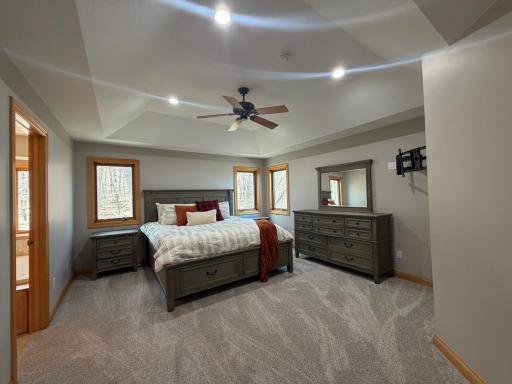 spacious primary bedroom with new carpet