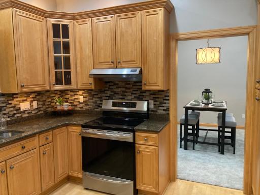 custom maple cabinets with crown molding, backlighting, & soft close drawers