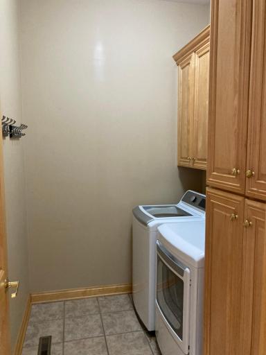 Main floor laundry with ample cabinet space