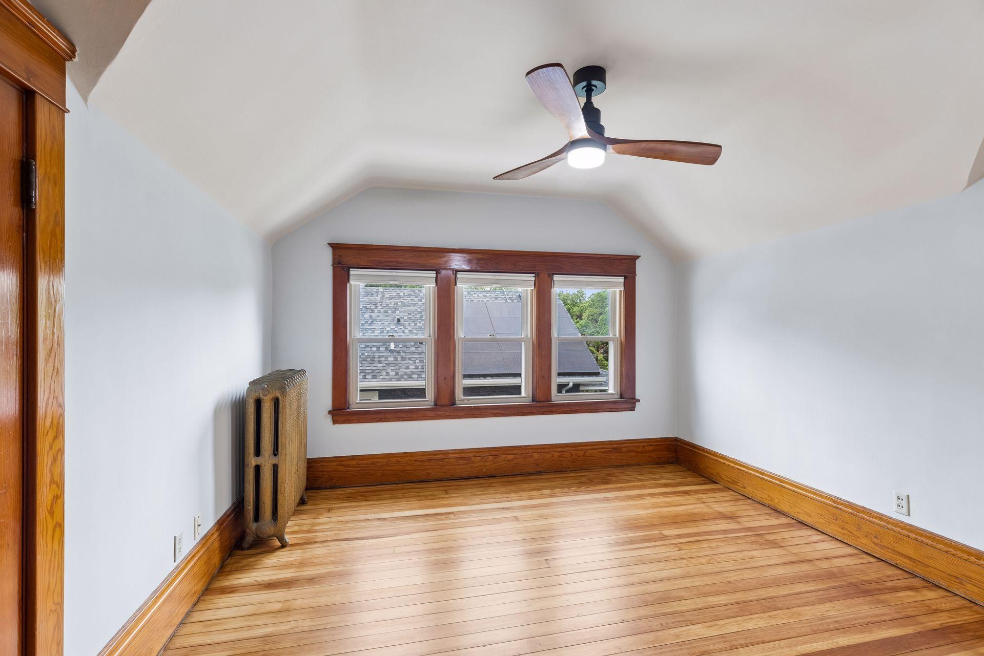 One of two upper level bedrooms. The entire upper level has newly refinished hardwood floors.
