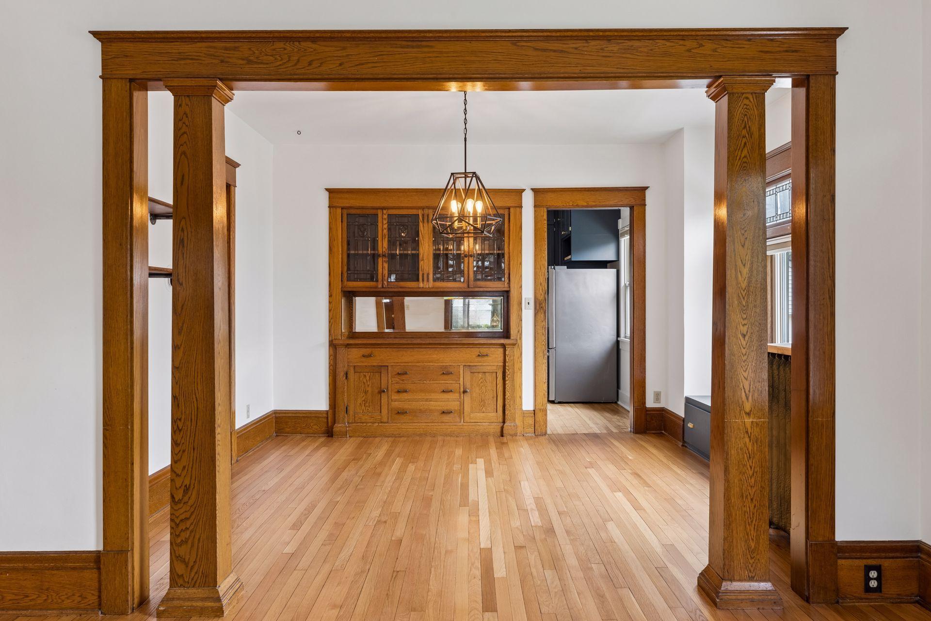 Simply gorgeous tapered columns highlighting the entrance to the formal dining room.