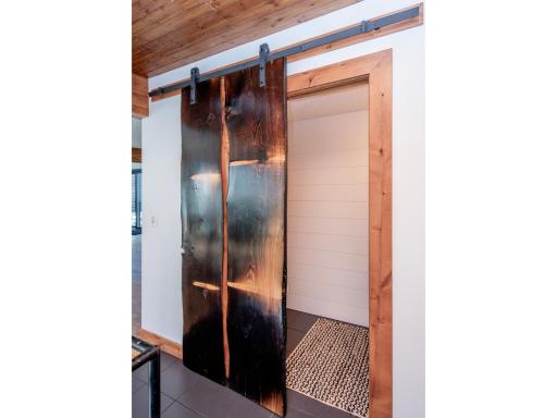 updated 1/2 bath on the main floor with gorgeous barn door