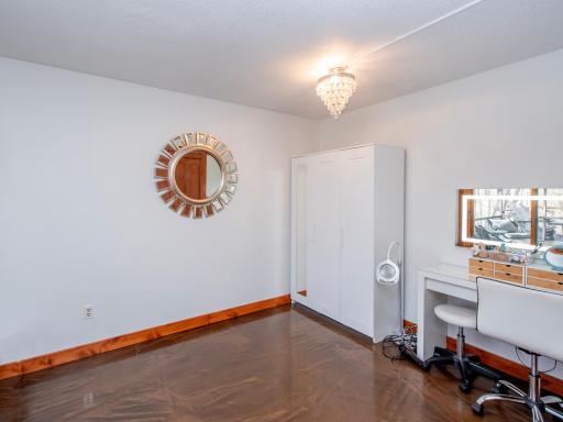 main level bedroom currently used as an office, newer metallic epoxy flooring