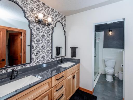 primary bathroom with metallic epoxy flooring