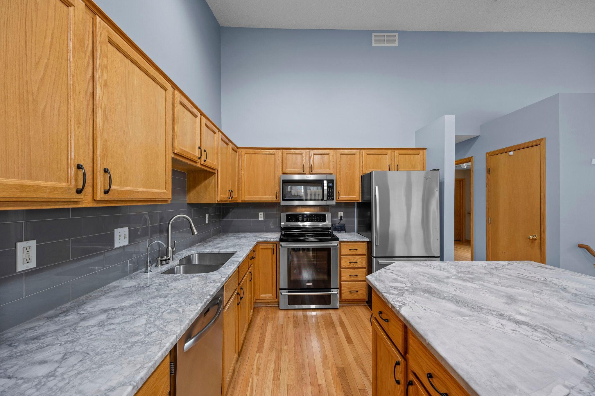 New granite counters with ample space to cook