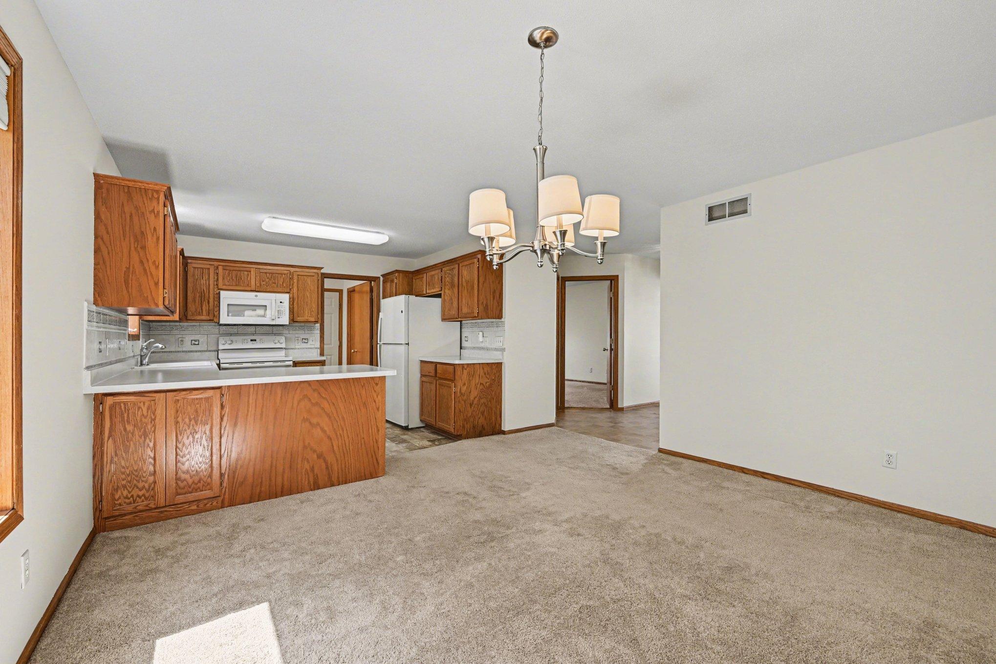 Step into this move-in ready one-level home and feel the bright, open flow. The entire space is freshly painted with professionally shampooed carpets. Enjoy a clean, thoughtful layout designed for effortless living and immediate comfort.