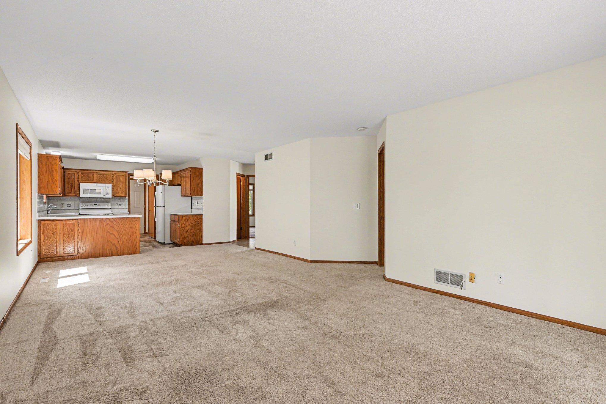 The kitchen, large living room, and dining area offer a bright, open flow with plenty of space for your furniture. Perfect for entertaining, this move-in ready layout is designed for effortless hosting and comfortable daily living.
