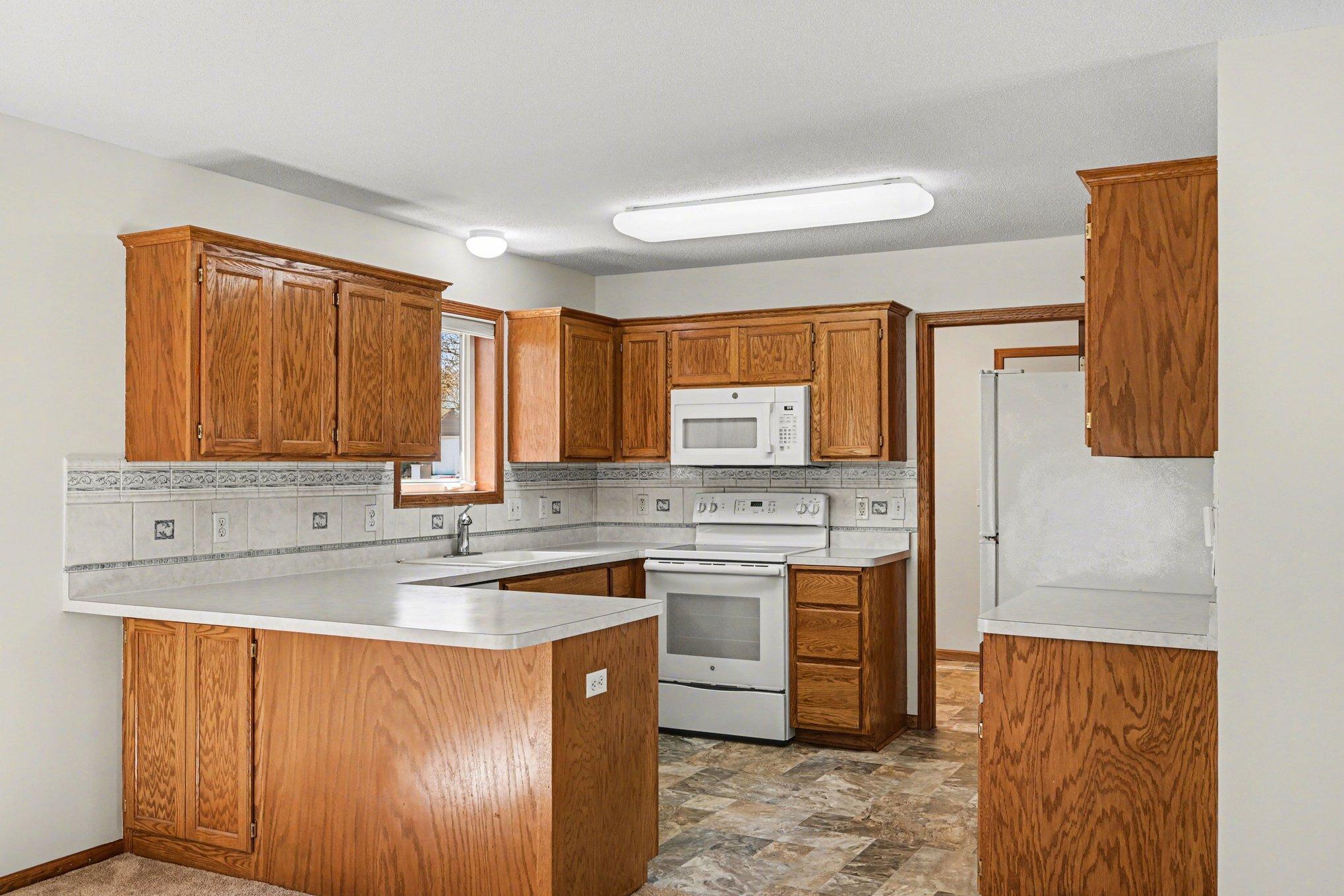 Another view of the spacious kitchen.